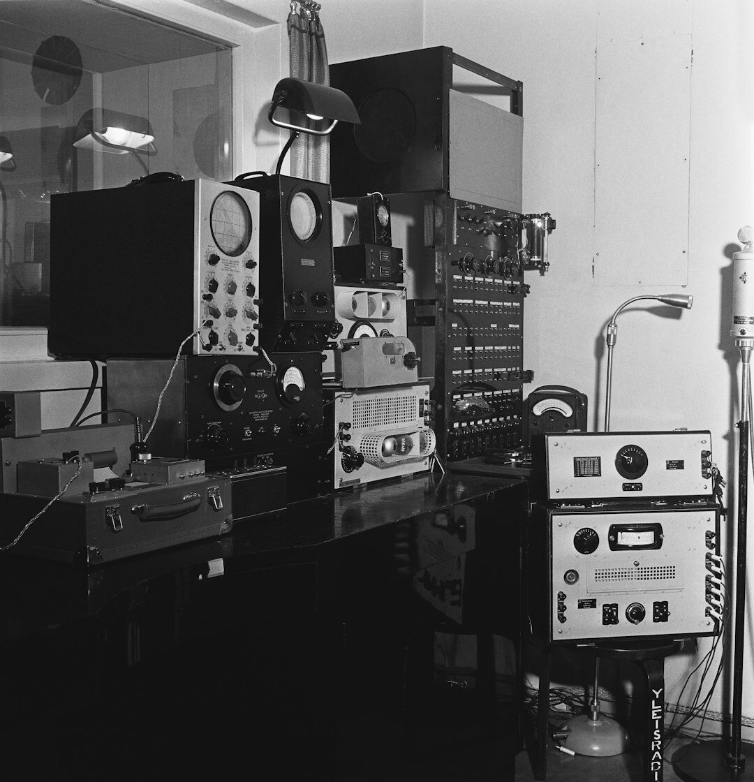 Broadcast production control room with multiple monitors showing different camera views