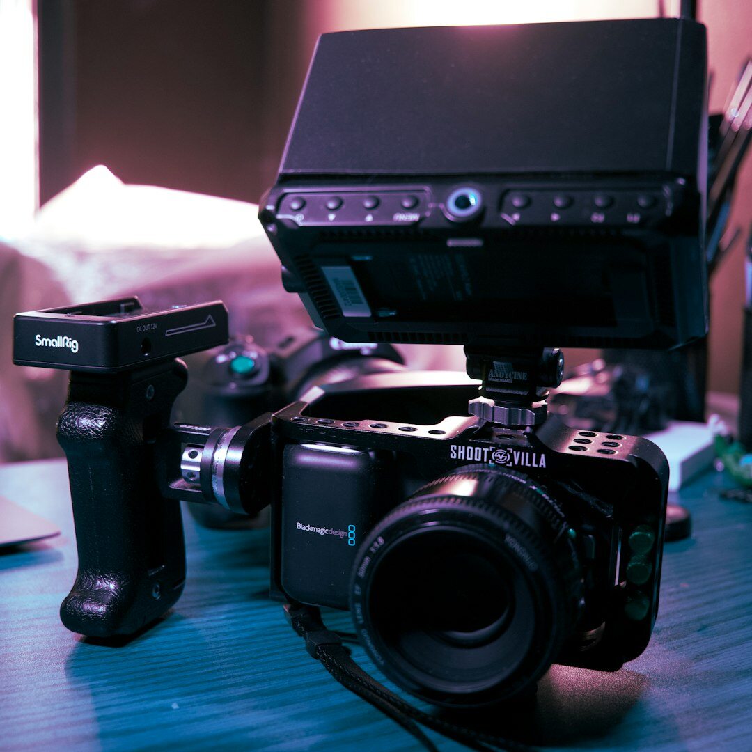 Professional video camera on tripod in a broadcast studio
